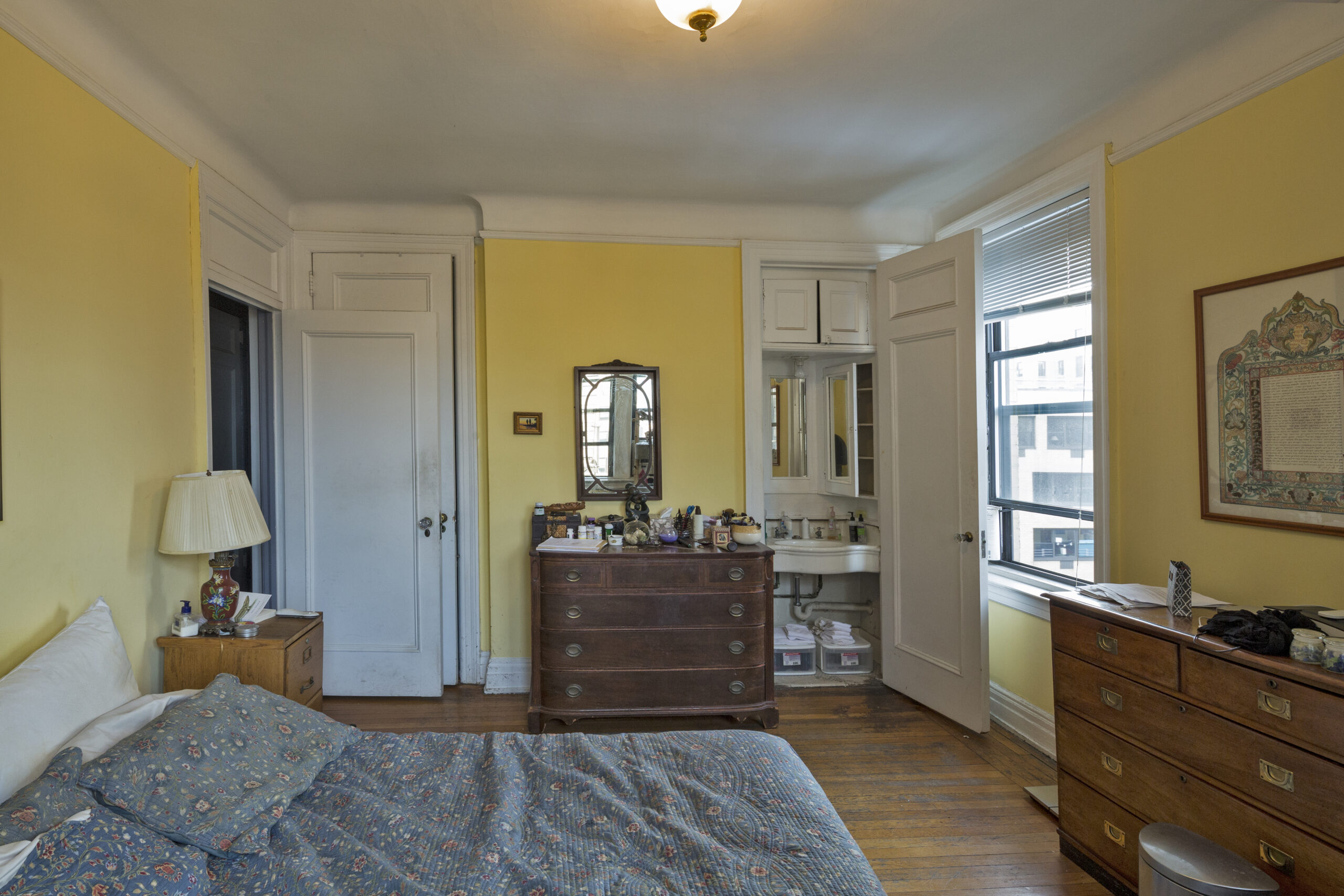 The Prime Bedroom is yellow with furniture from when the couple was first married; it had one clothes closet.