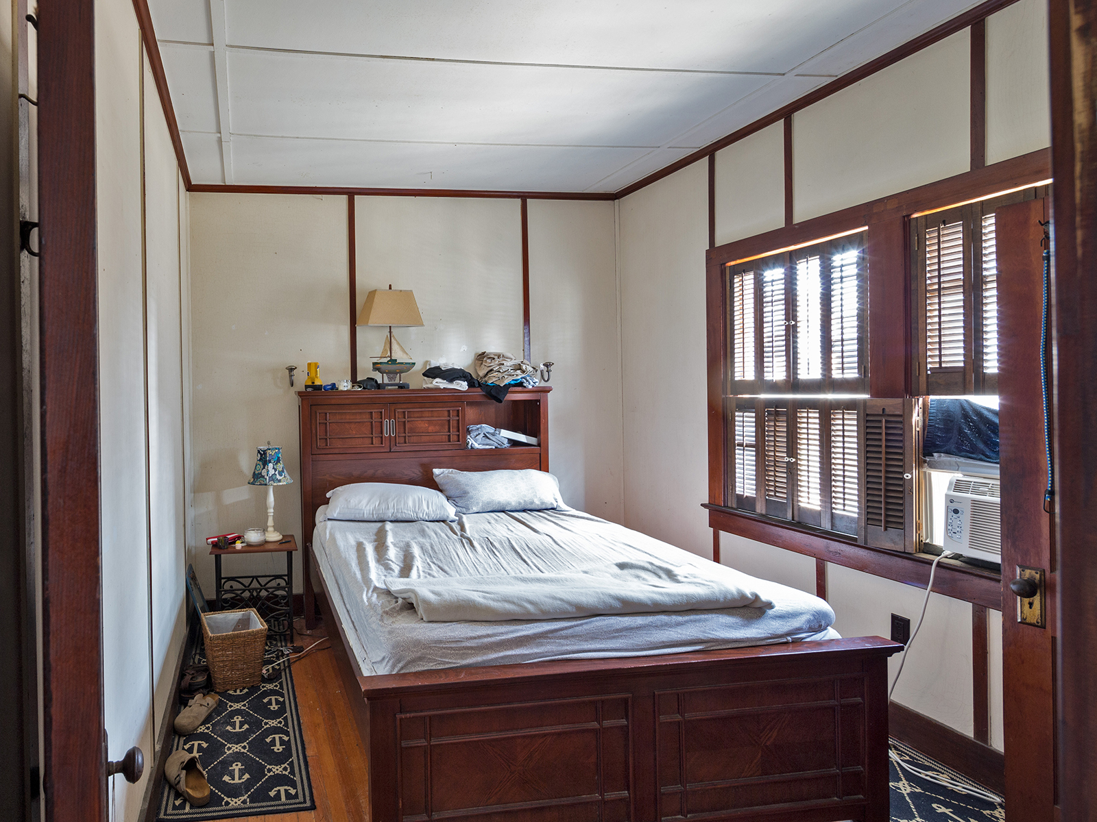 Main Bedroom Before: Fits a queen-size bed, it's a small room and two windows