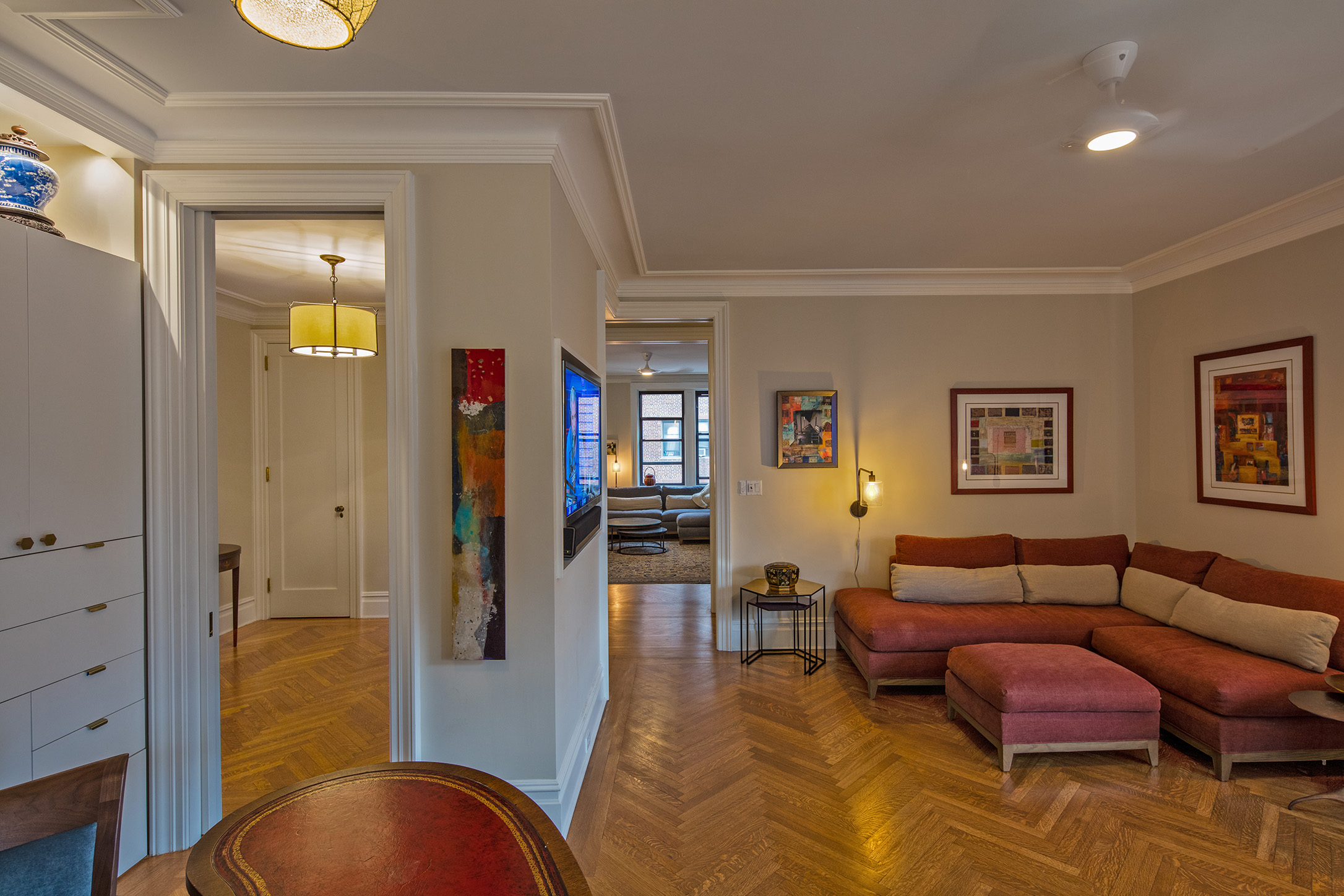 The service’s corridor is open to the Dining Room to the right, and the Living room is visible through the Foyer.