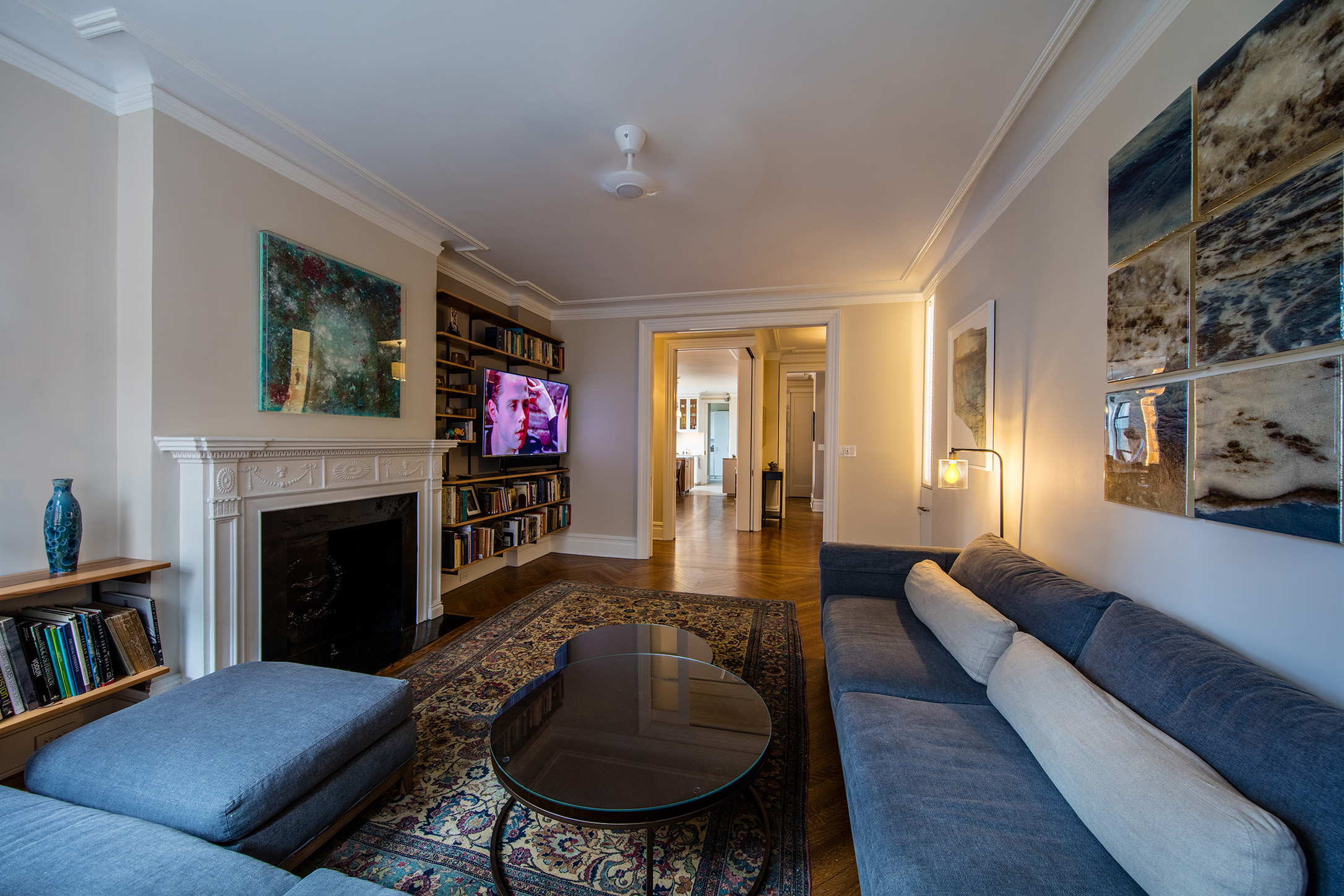 You can see through the Dining Room to the Kitchen beyond from the redecorated Living Room.