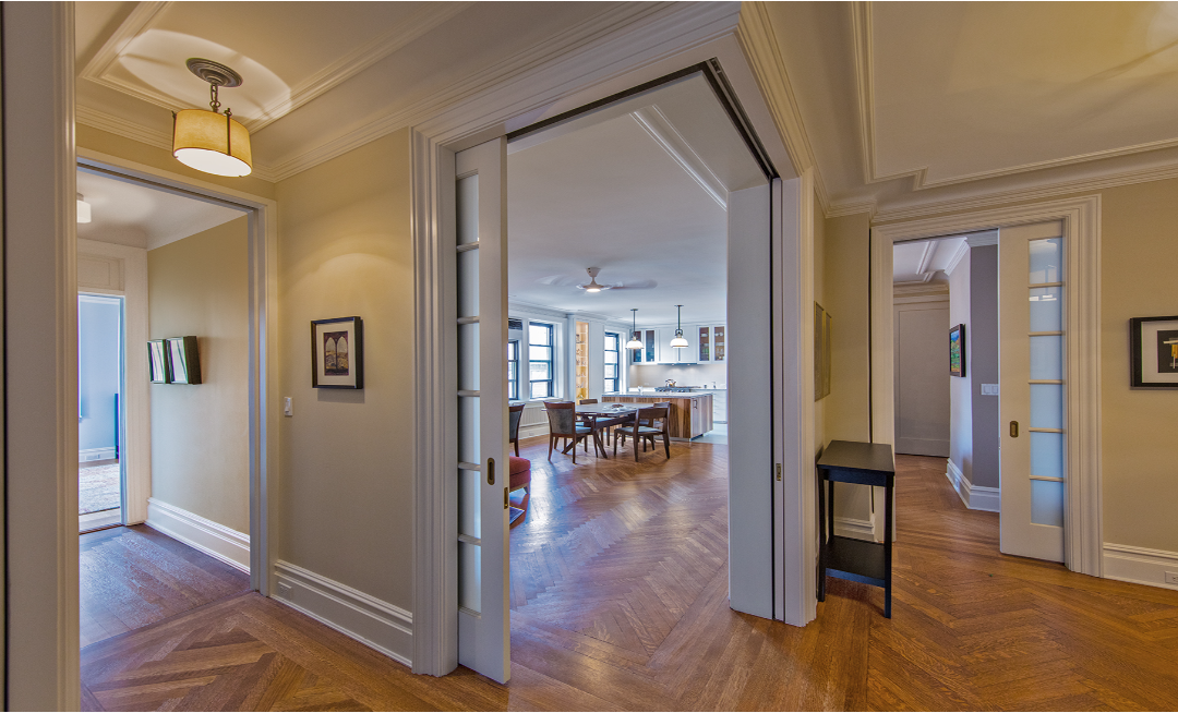 Dynamic corner doorway between a prewar Foyer to a windowed Family Room, Dining Room, and Kitchen