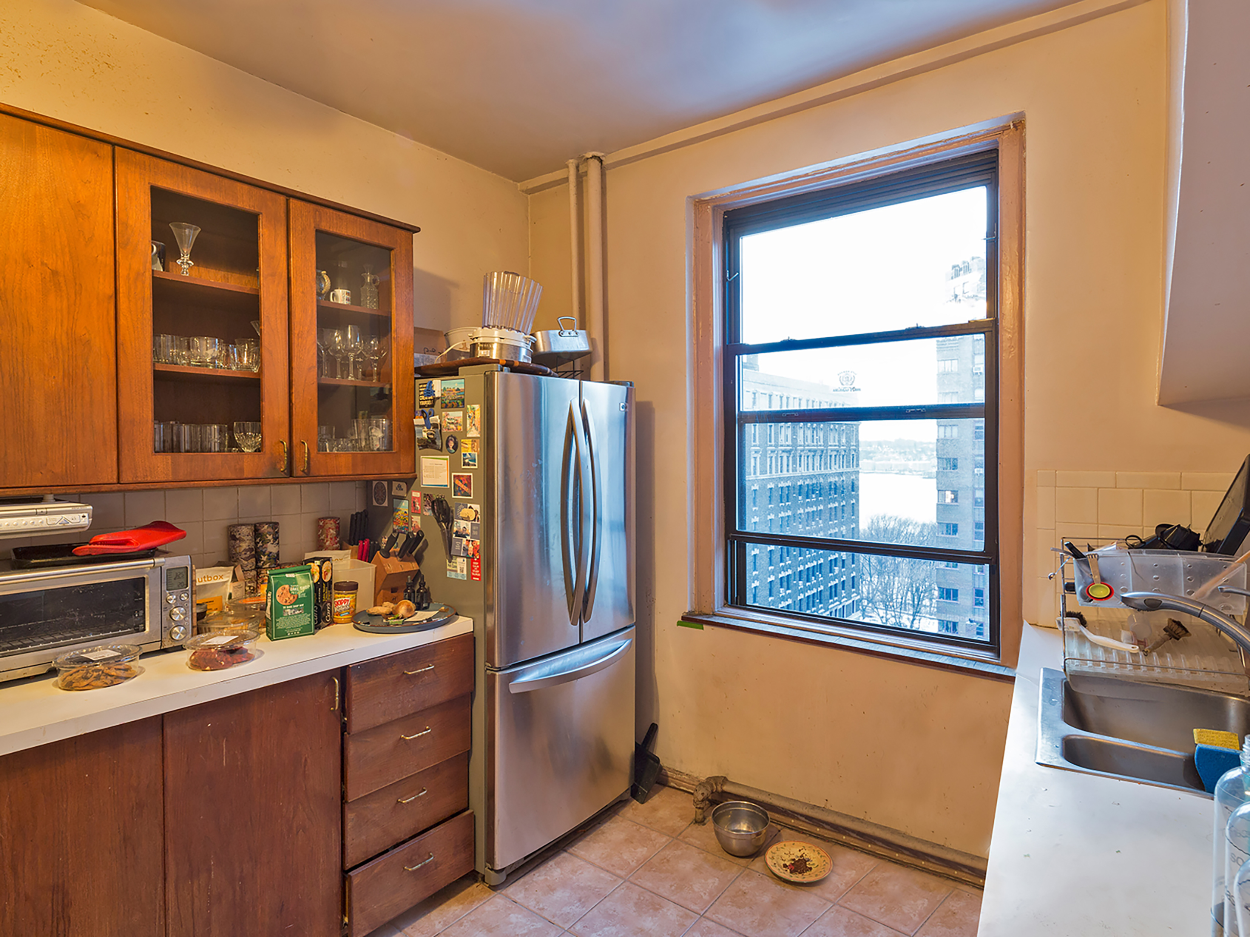 The wide Galley Kitchen dated from the 1980s with a large window looking west